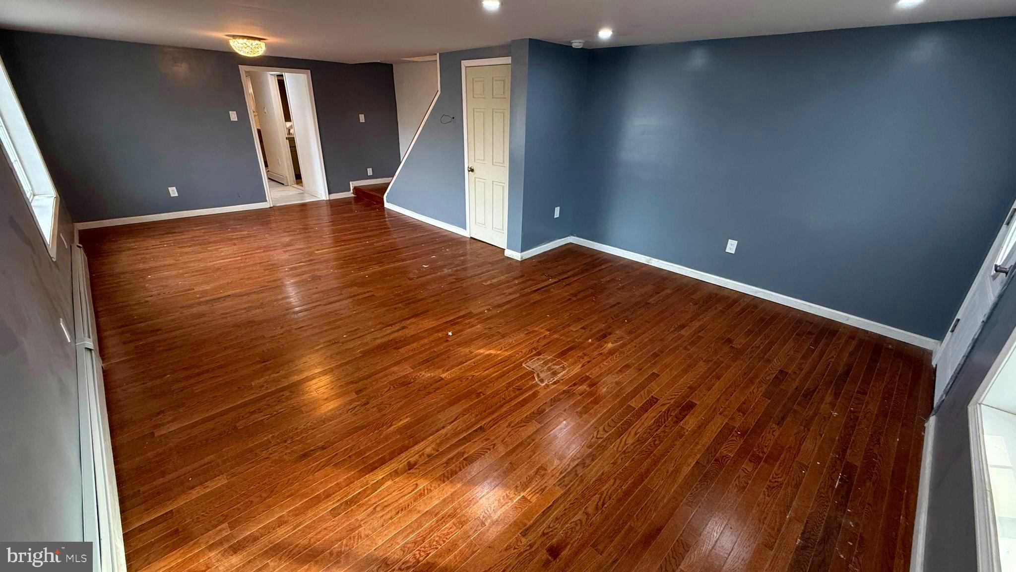 210 Cherry Street Duryea, PA 18642 - Photo 9 of 26 wooden floor in an empty room with a window