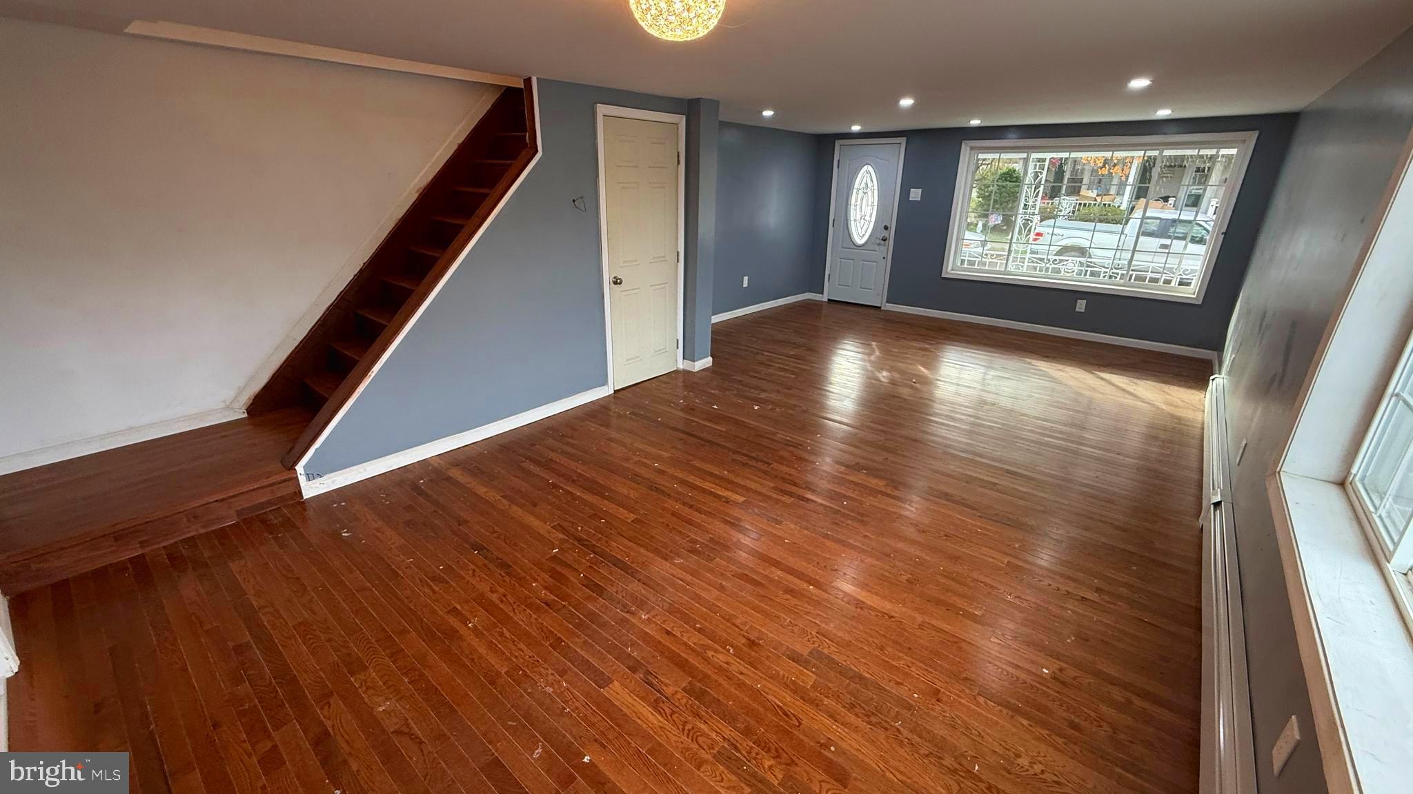 210 Cherry Street Duryea, PA 18642 - Photo 10 of 26 a view of an empty room with wooden floor and a window