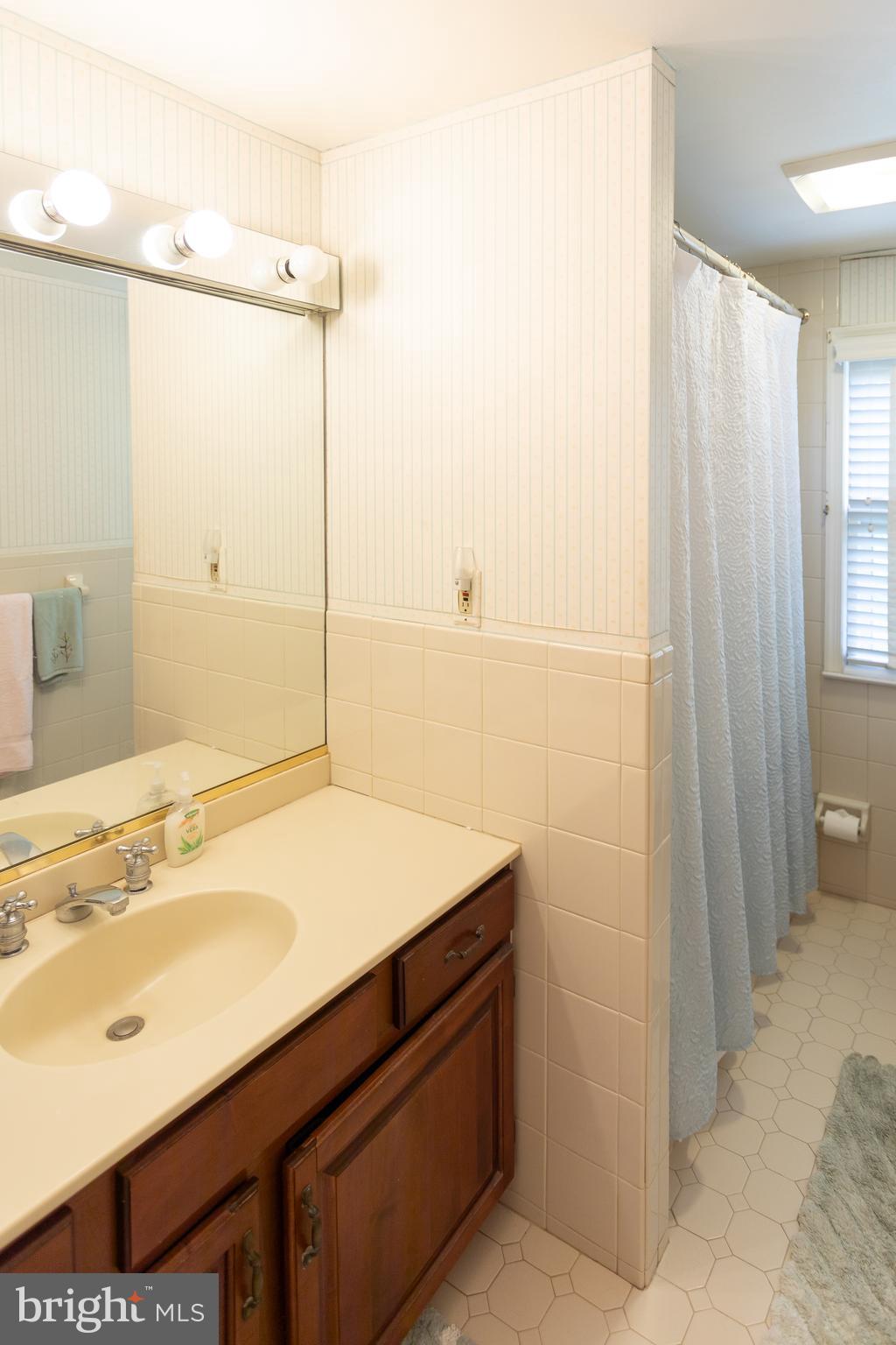 1179 Beaumont Road Berwyn, PA 19312 - Photo 61 of 64 a bathroom with a sink and a mirror