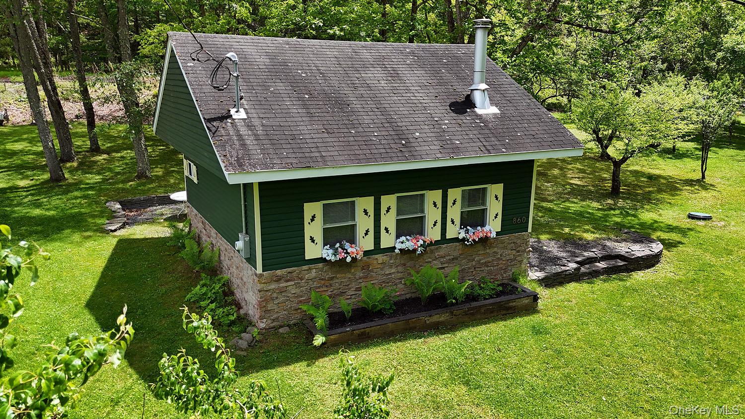 860 River Road Callicoon, NY 12723 - Photo 3 of 45 a house view with a garden space