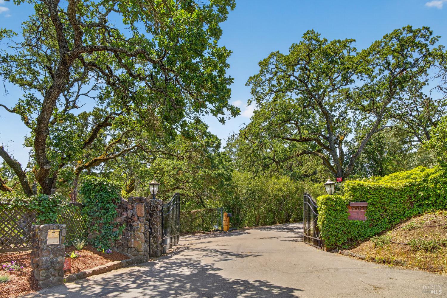 10 Lockton Lane Novato, CA 94945 - Photo 65 of 68 Gated entrance to Lockton Lane, creating a quiet, private, and tucked-away setting within Novato’s Green Point neighborhood.