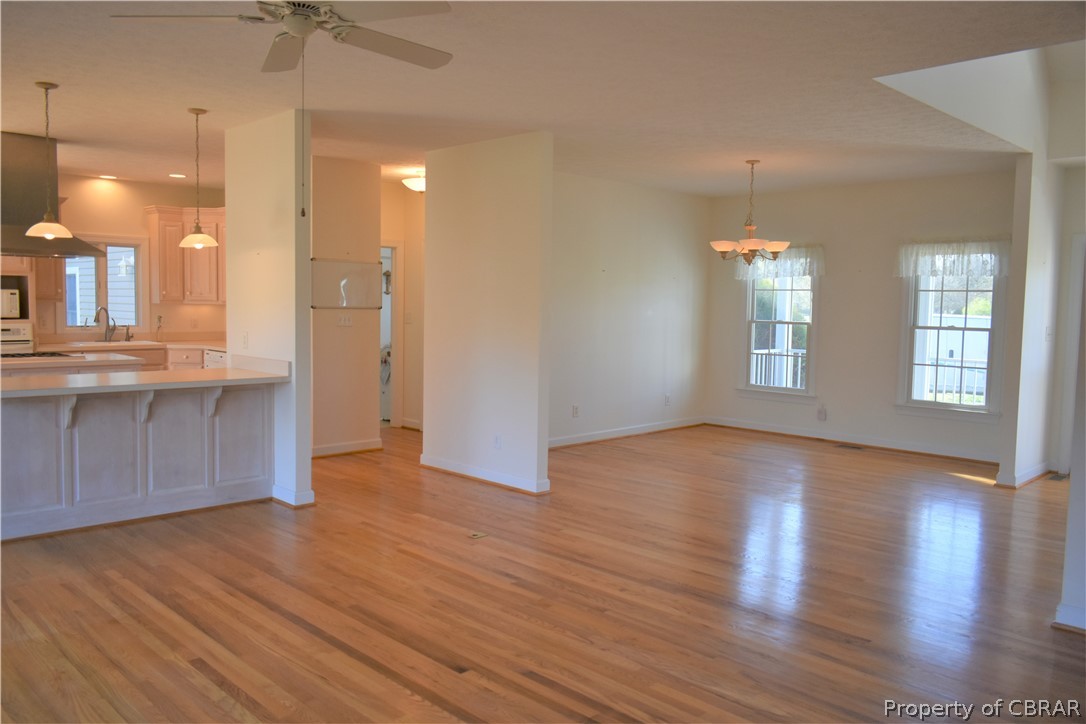 163 Mill Lane Road Cardinal, VA 23025 - Photo 22 of 50 a view of an empty room with window and wooden floor
