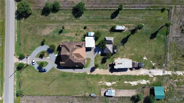 an aerial view of houses with outdoor space