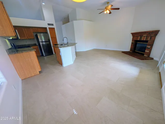 a stove top oven sitting inside of a kitchen and granite counter tops