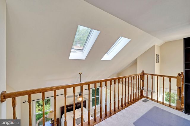 a view of staircase with rug floor