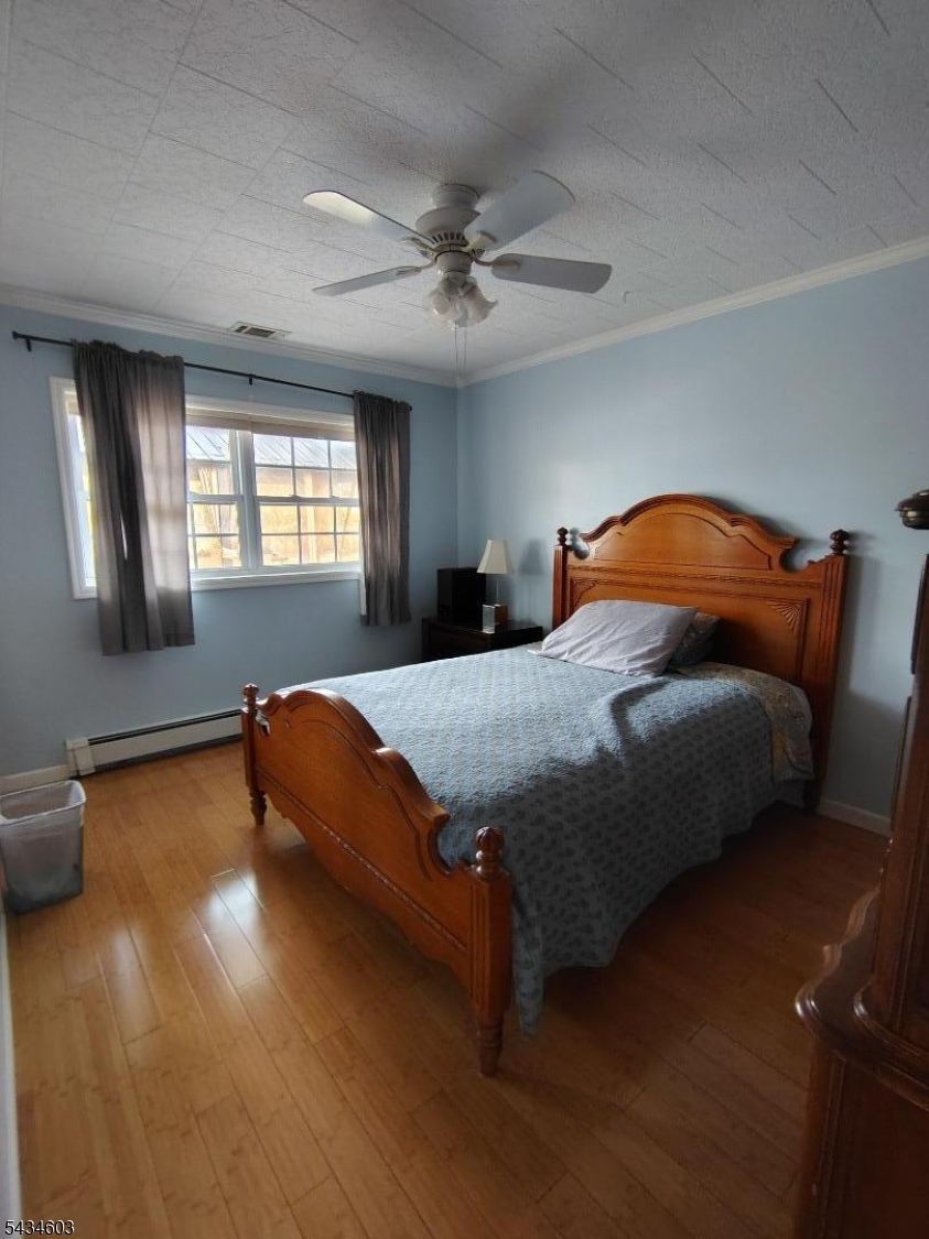 442 River Road North Arlington, NJ 07031 - Photo 12 of 26 a bedroom with a bed and window