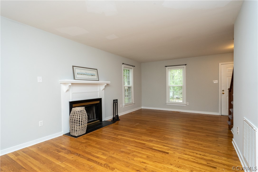 5800 Mill Spring Road Midlothian, VA 23112 - Photo 5 of 22 a view of empty room with a fireplace and wooden floor