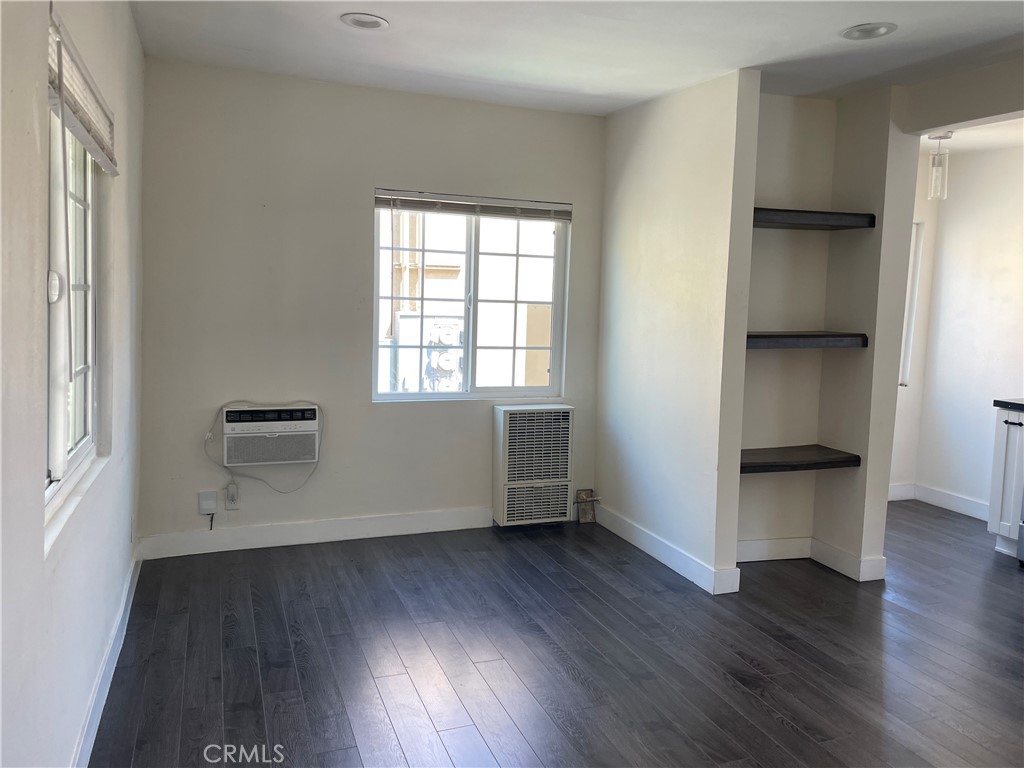 1325 1/2 Douglas Street Los Angeles, CA 90026 - Photo 1 of 23 an empty room with wooden floor and windows