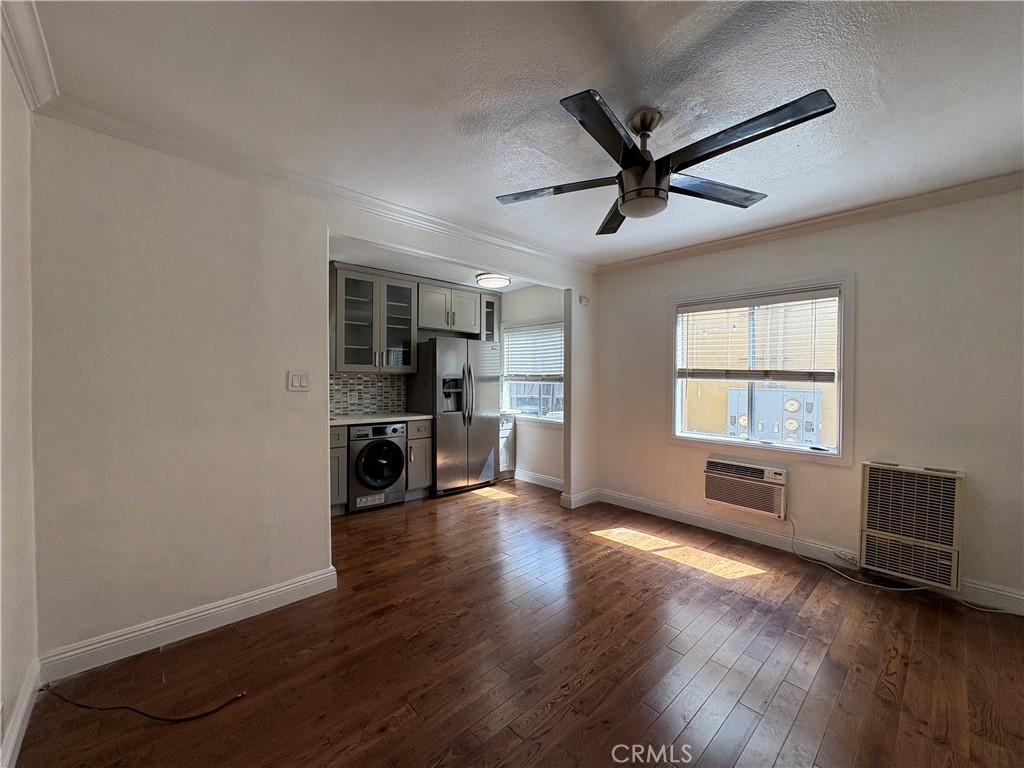 1325 1/2 Douglas Street Los Angeles, CA 90026 - Photo 15 of 23 a view of a livingroom with a hardwood floor and a ceiling fan