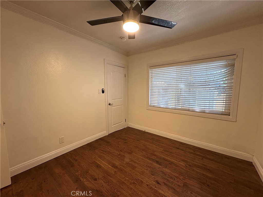 1325 1/2 Douglas Street Los Angeles, CA 90026 - Photo 17 of 23 a view of an empty room with wooden floor and a window