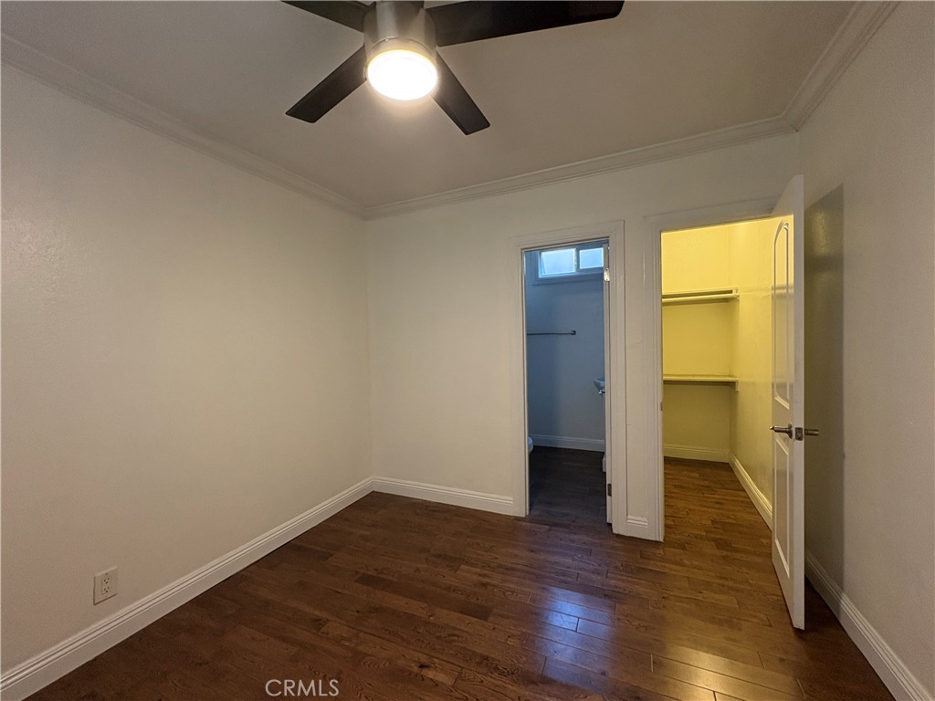 1325 1/2 Douglas Street Los Angeles, CA 90026 - Photo 19 of 23 an empty room with wooden floor and a ceiling fan