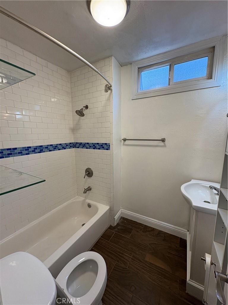 1325 1/2 Douglas Street Los Angeles, CA 90026 - Photo 23 of 23 a bathroom with a toilet a sink and bathtub