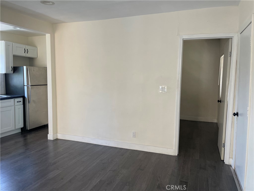 1325 1/2 Douglas Street Los Angeles, CA 90026 - Photo 3 of 23 a view of a kitchen with wooden floor and electronic appliances