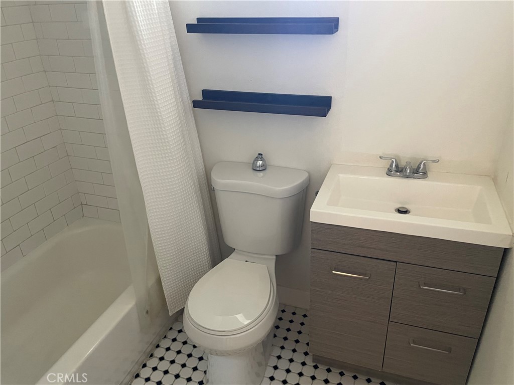 1325 1/2 Douglas Street Los Angeles, CA 90026 - Photo 10 of 23 a bathroom with a sink a toilet and shower