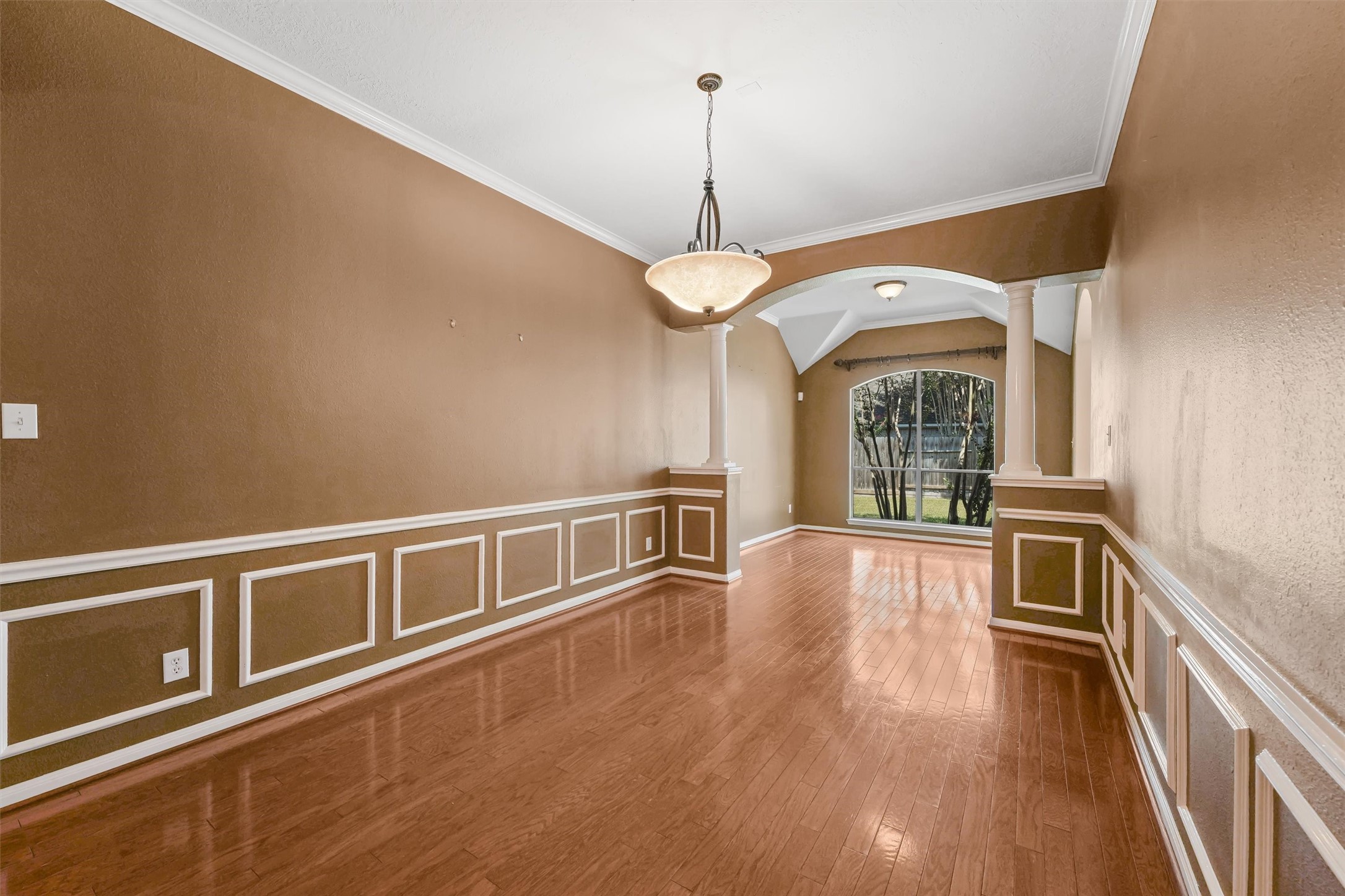 6803 Rhodes Court Missouri City, TX 77459 - Photo 3 of 13 a view of an empty room with window and wooden floor