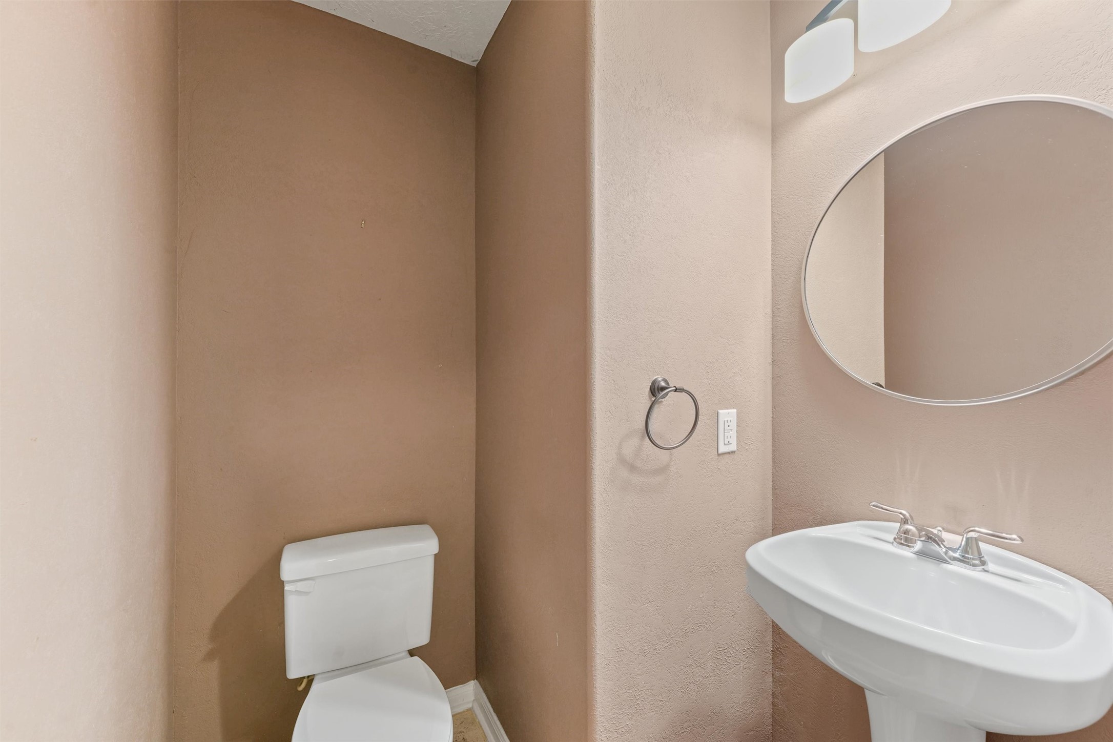 6803 Rhodes Court Missouri City, TX 77459 - Photo 9 of 13 a bathroom with a sink mirror and toilet