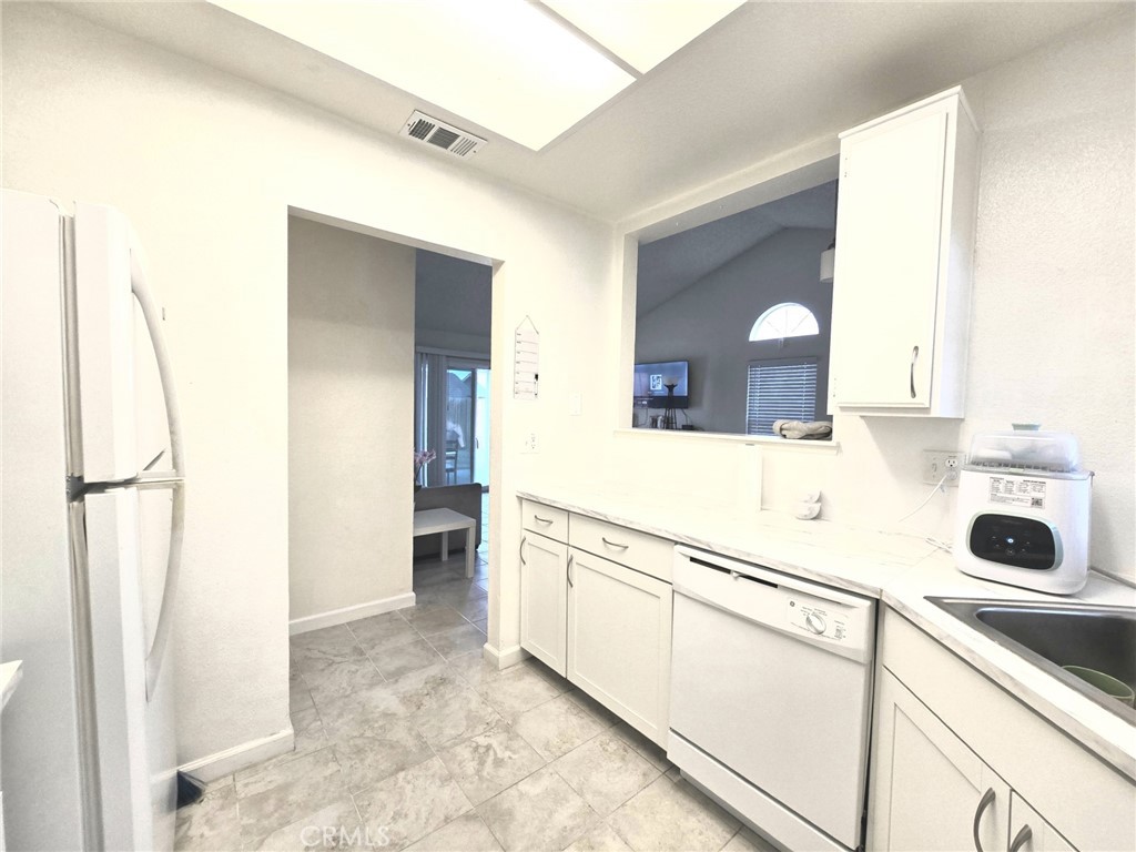 36839 Goldenview Way Palmdale, CA 93552 - Photo 12 of 20 a bathroom with a sink a toilet and a mirror