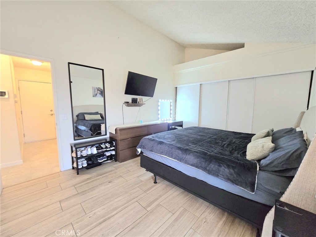 36839 Goldenview Way Palmdale, CA 93552 - Photo 15 of 20 a bedroom with a bed a flat screen tv and dresser