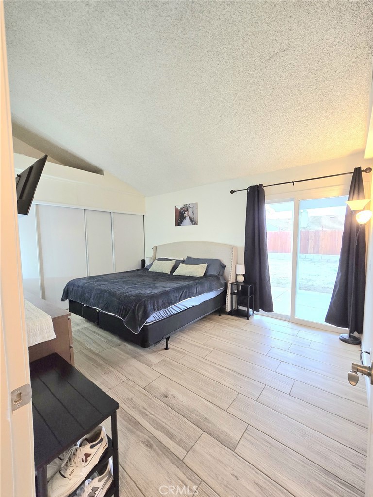36839 Goldenview Way Palmdale, CA 93552 - Photo 16 of 20 a bedroom with a bed and large window