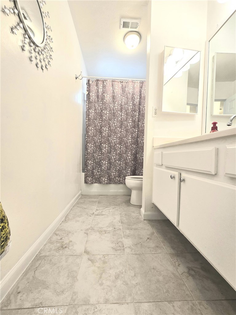 36839 Goldenview Way Palmdale, CA 93552 - Photo 17 of 20 a bathroom with a sink toilet and shower
