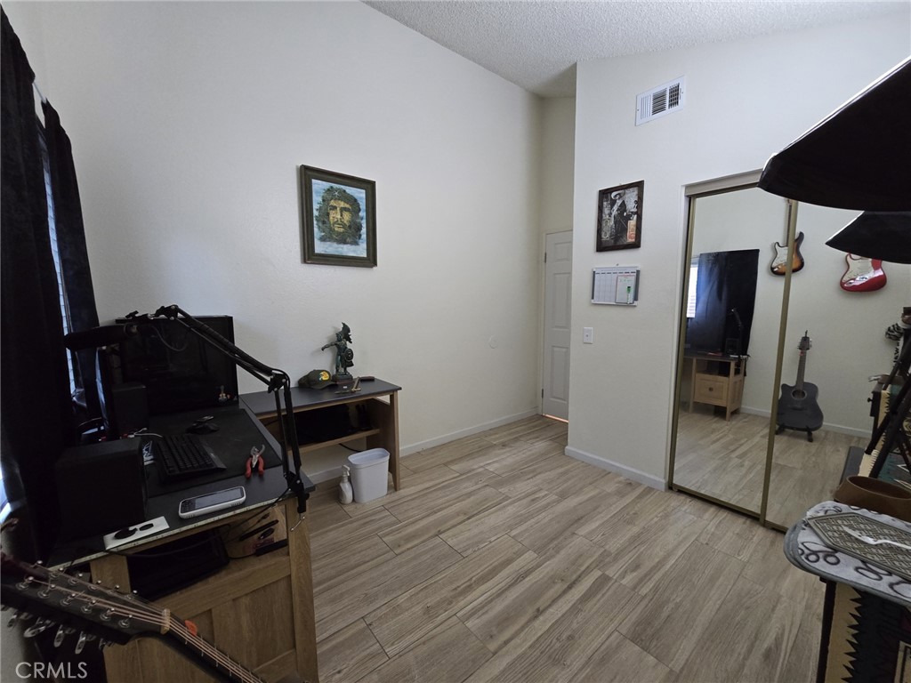 36839 Goldenview Way Palmdale, CA 93552 - Photo 18 of 20 a living room with furniture and a flat screen tv