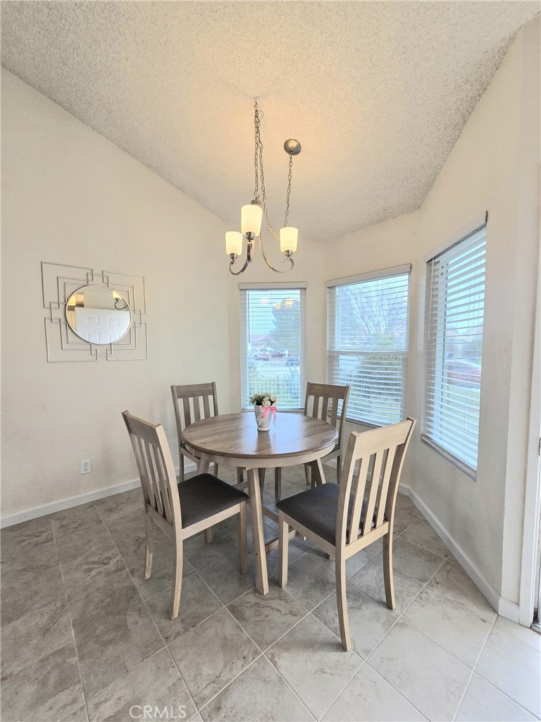 36839 Goldenview Way Palmdale, CA 93552 - Photo 5 of 20 a view of a dining room with furniture and window