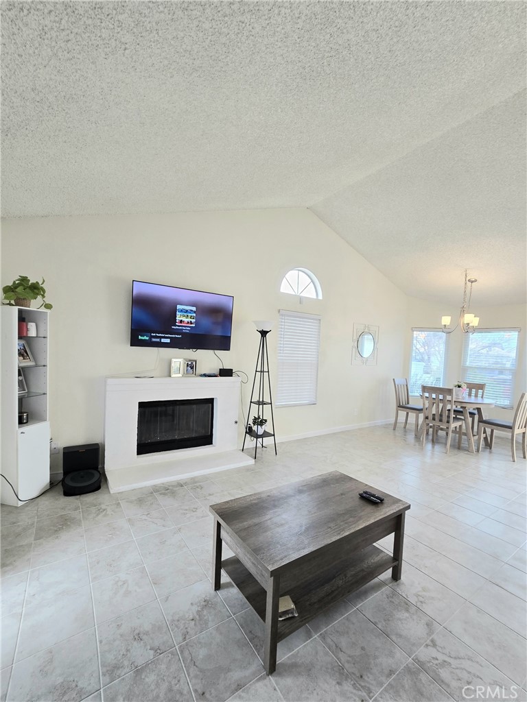 36839 Goldenview Way Palmdale, CA 93552 - Photo 9 of 20 a living room with furniture and a fireplace