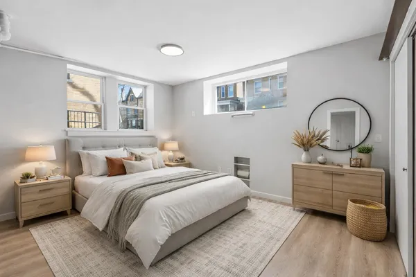 a bedroom with a bed and a dresser