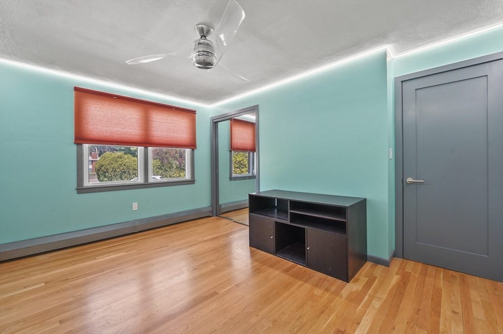 182 Needham Street Dedham, MA 02026 - Photo 13 of 33 a room with window and ceiling fan