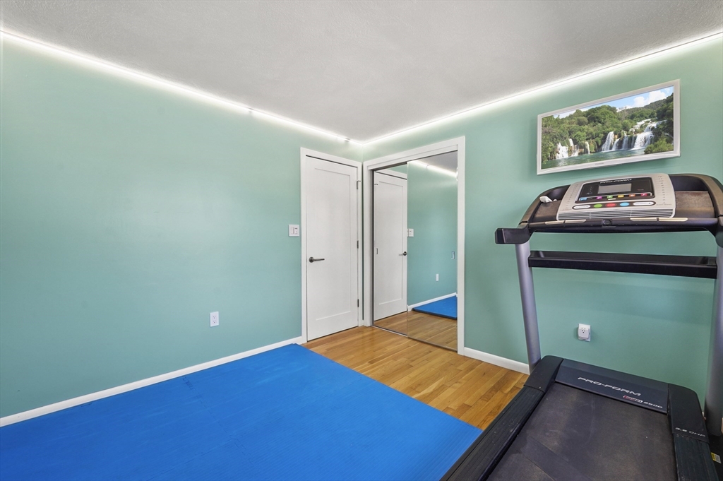 182 Needham Street Dedham, MA 02026 - Photo 14 of 33 a room with pool table and paintings on the wall