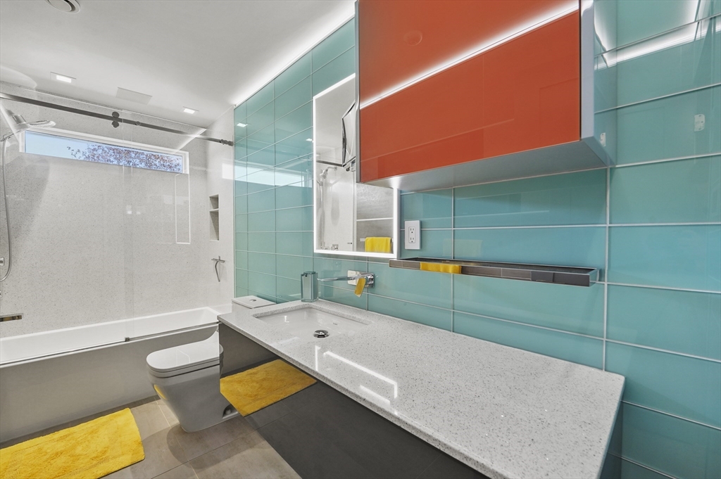 182 Needham Street Dedham, MA 02026 - Photo 16 of 33 a bathroom with a sink toilet and shower