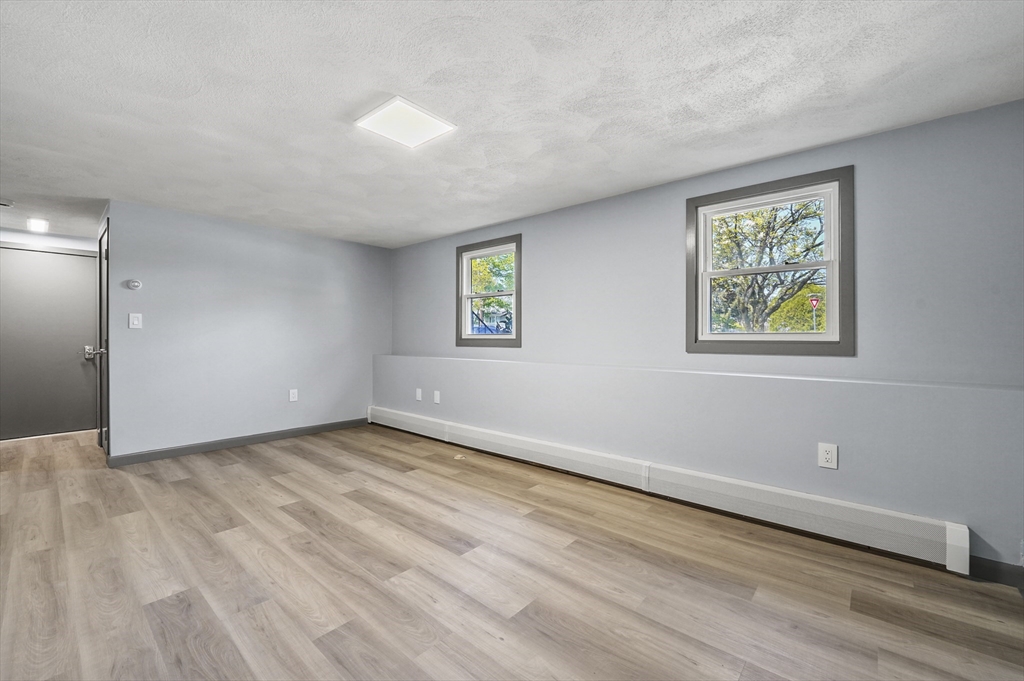 182 Needham Street Dedham, MA 02026 - Photo 17 of 33 an empty room with windows