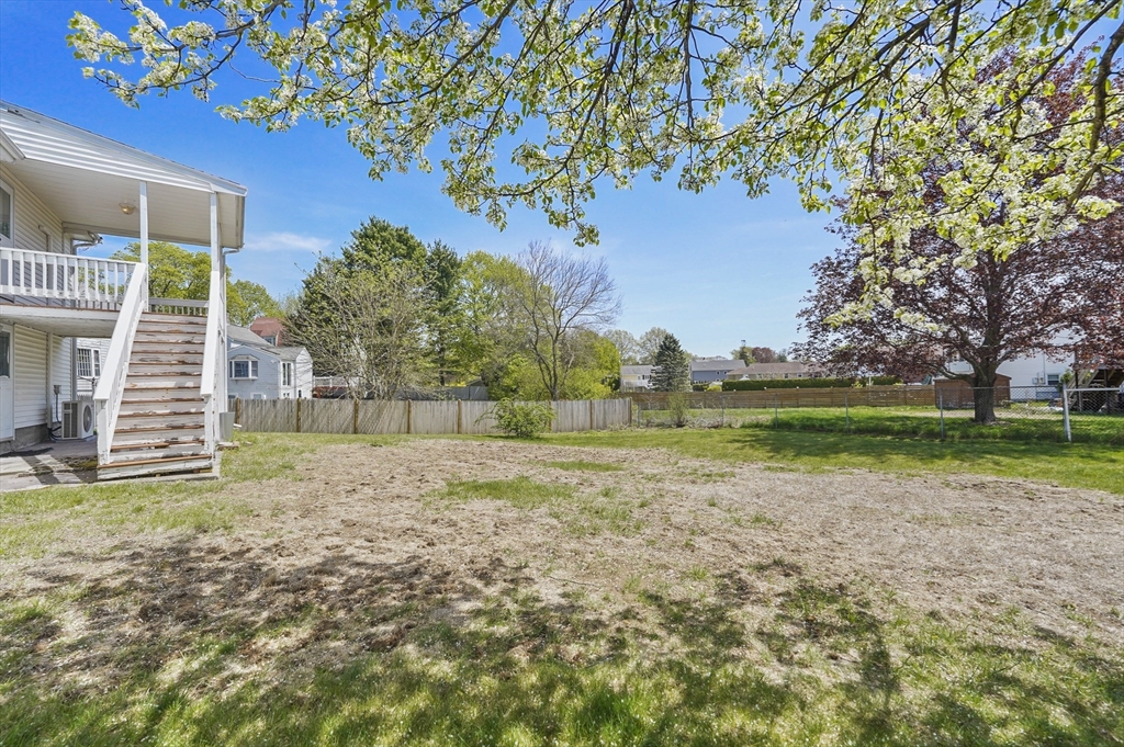182 Needham Street Dedham, MA 02026 - Photo 25 of 33 a view of a yard with yellow house