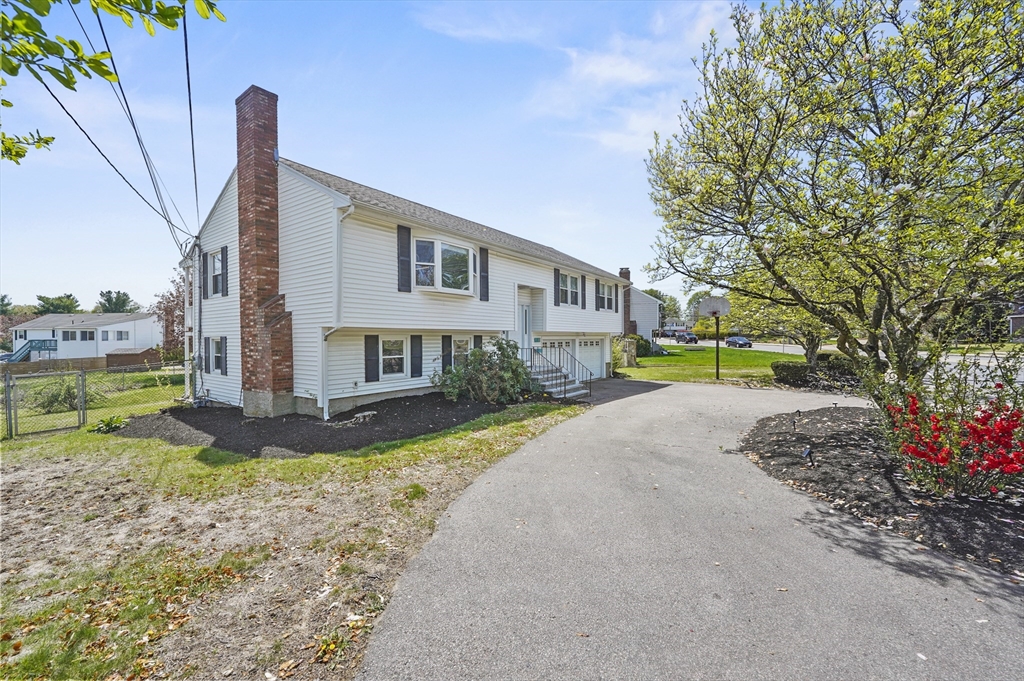 182 Needham Street Dedham, MA 02026 - Photo 30 of 33 a view of a house with a yard and pathway