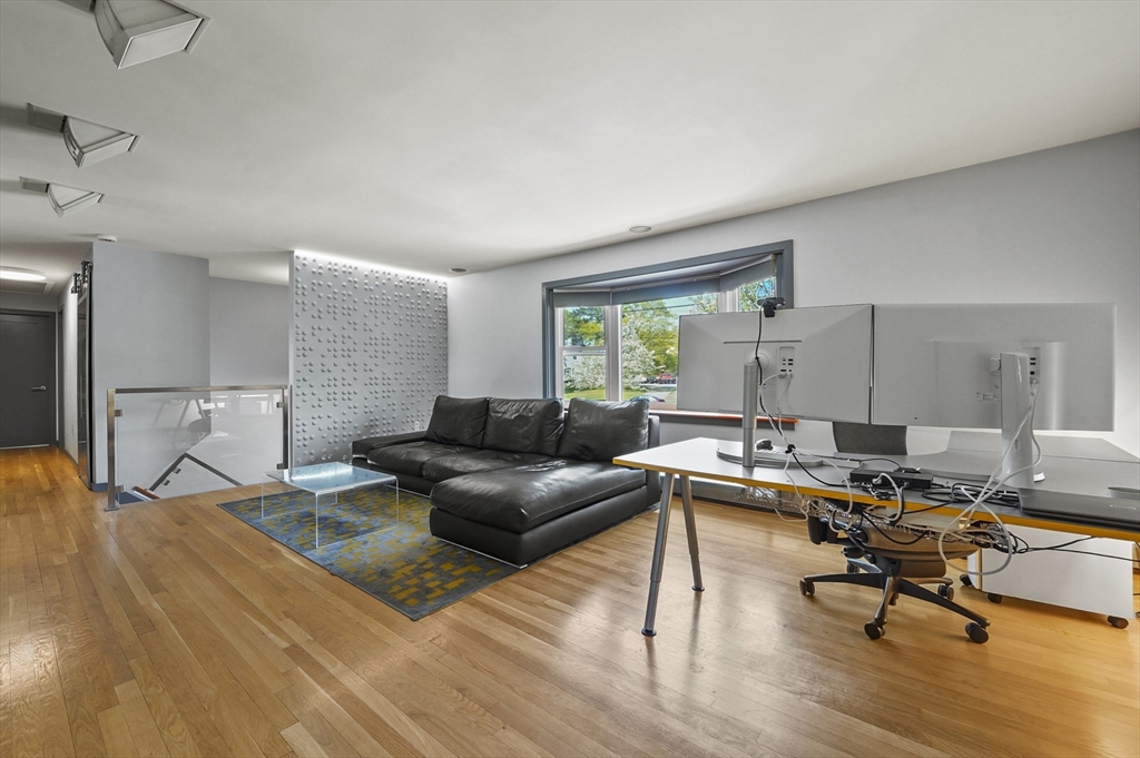 182 Needham Street Dedham, MA 02026 - Photo 3 of 33 a living room with furniture and a wooden floor