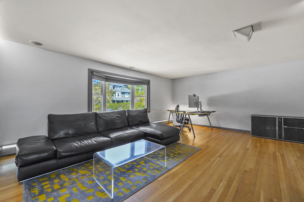 182 Needham Street Dedham, MA 02026 - Photo 4 of 33 a living room with furniture and a wooden floor