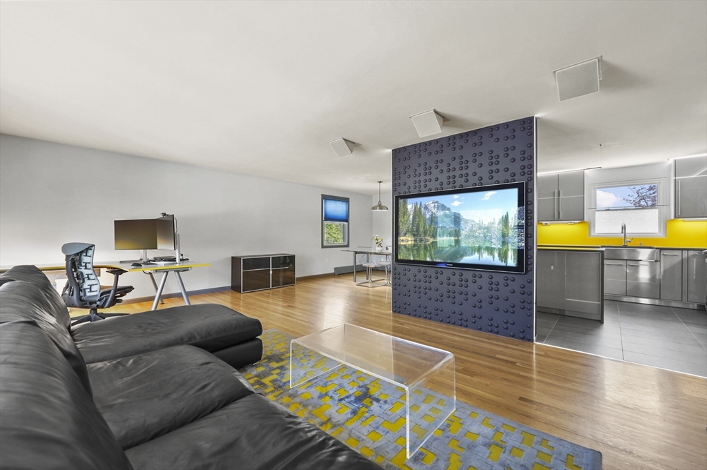 182 Needham Street Dedham, MA 02026 - Photo 5 of 33 a living room with furniture and a flat screen tv