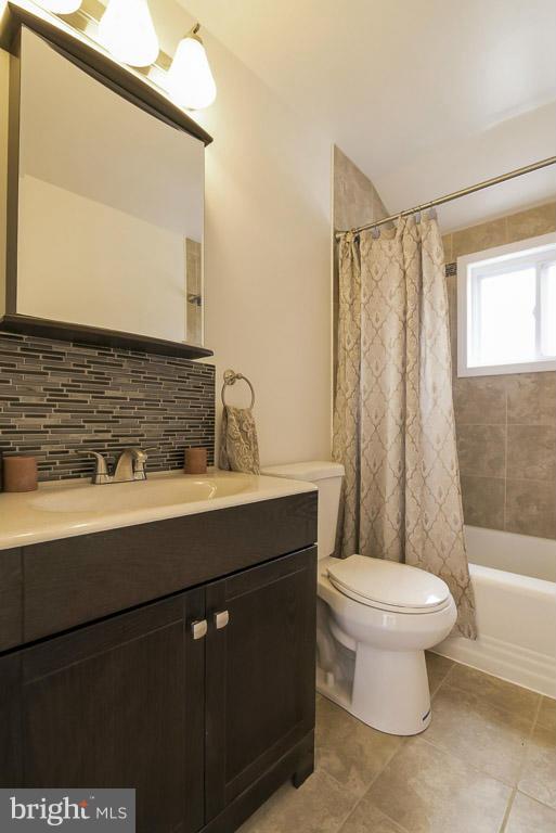 718 Middlesex Road Baltimore, MD 21221 - Photo 20 of 30 a bathroom with a sink toilet and shower