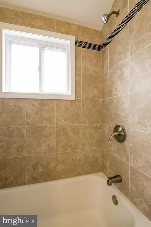 718 Middlesex Road Baltimore, MD 21221 - Photo 21 of 30 a bathroom with a bathtub