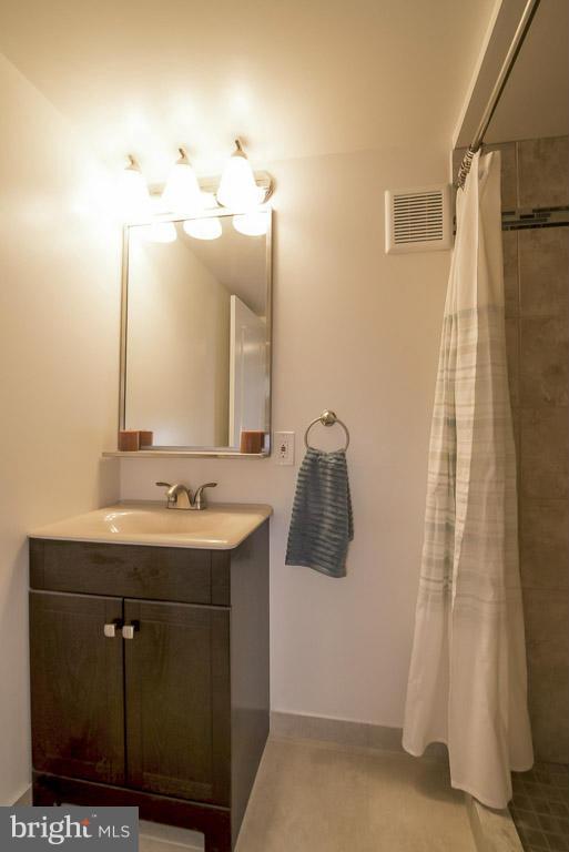 718 Middlesex Road Baltimore, MD 21221 - Photo 26 of 30 a bathroom with a sink and mirror with toilet