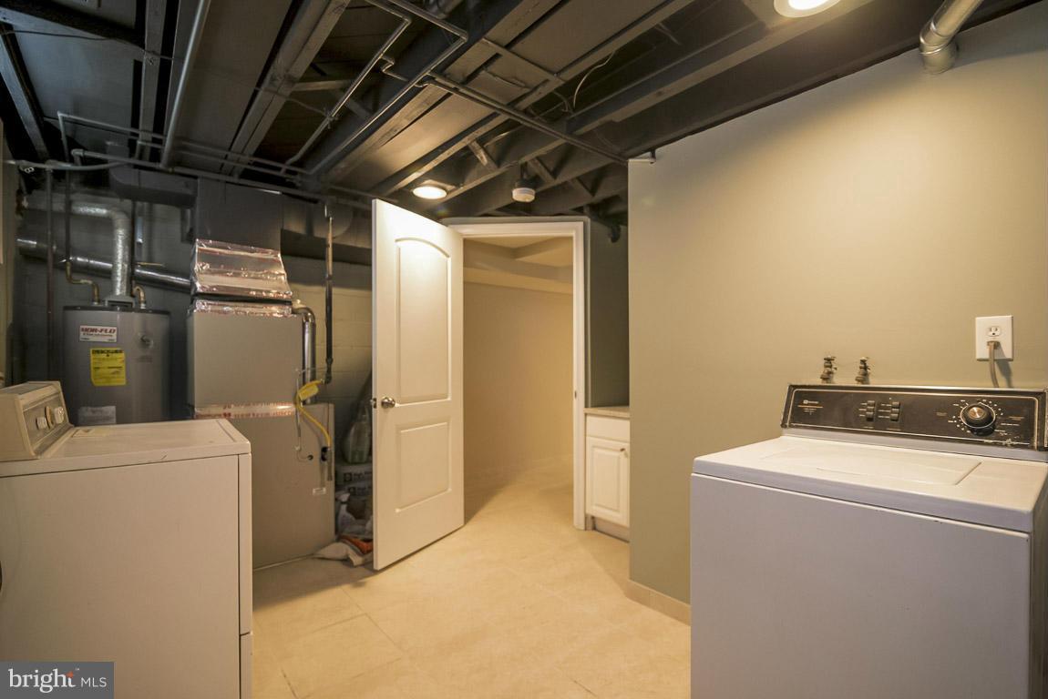 718 Middlesex Road Baltimore, MD 21221 - Photo 29 of 30 a utility room with dryer and washer