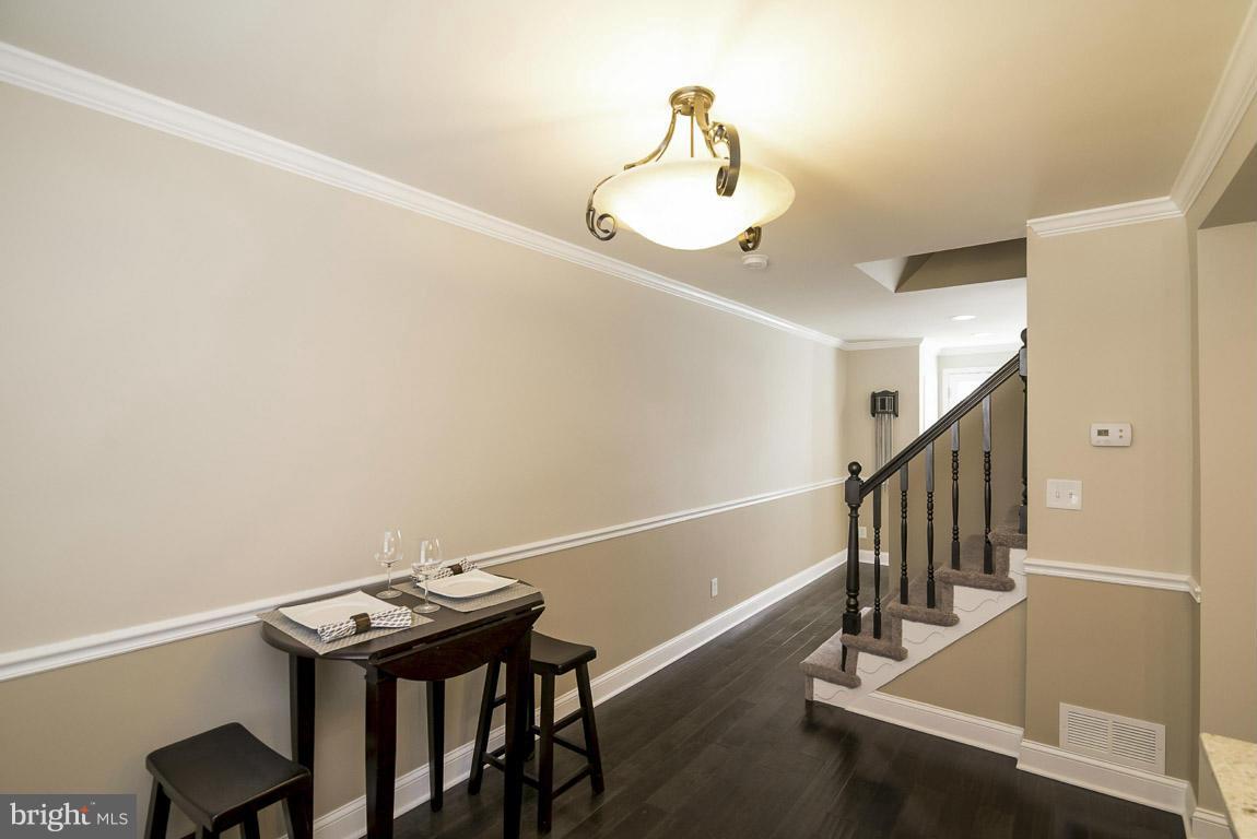 718 Middlesex Road Baltimore, MD 21221 - Photo 10 of 30 a view of entryway and hall with wooden floor