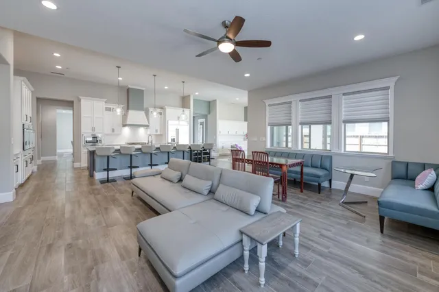 a kitchen with a stove a sink and a refrigerator