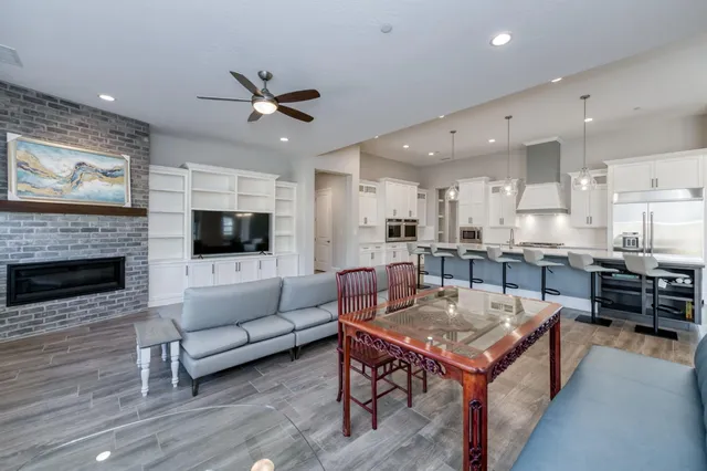 a large kitchen with lots of counter space a sink appliances and a window