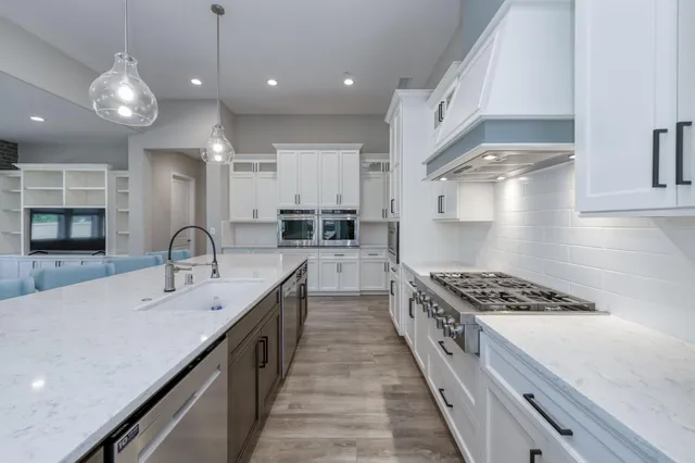 a kitchen with refrigerator and furniture
