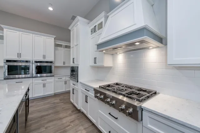 a dining room with wooden floor and a window