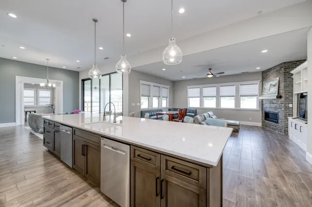 a view of an empty room and wooden floor