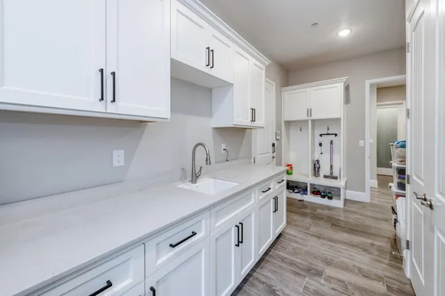 a bathroom with a double vanity sink mirror and shower