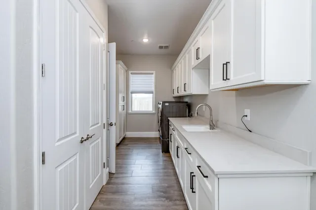 a bathroom with a shower and a glass door