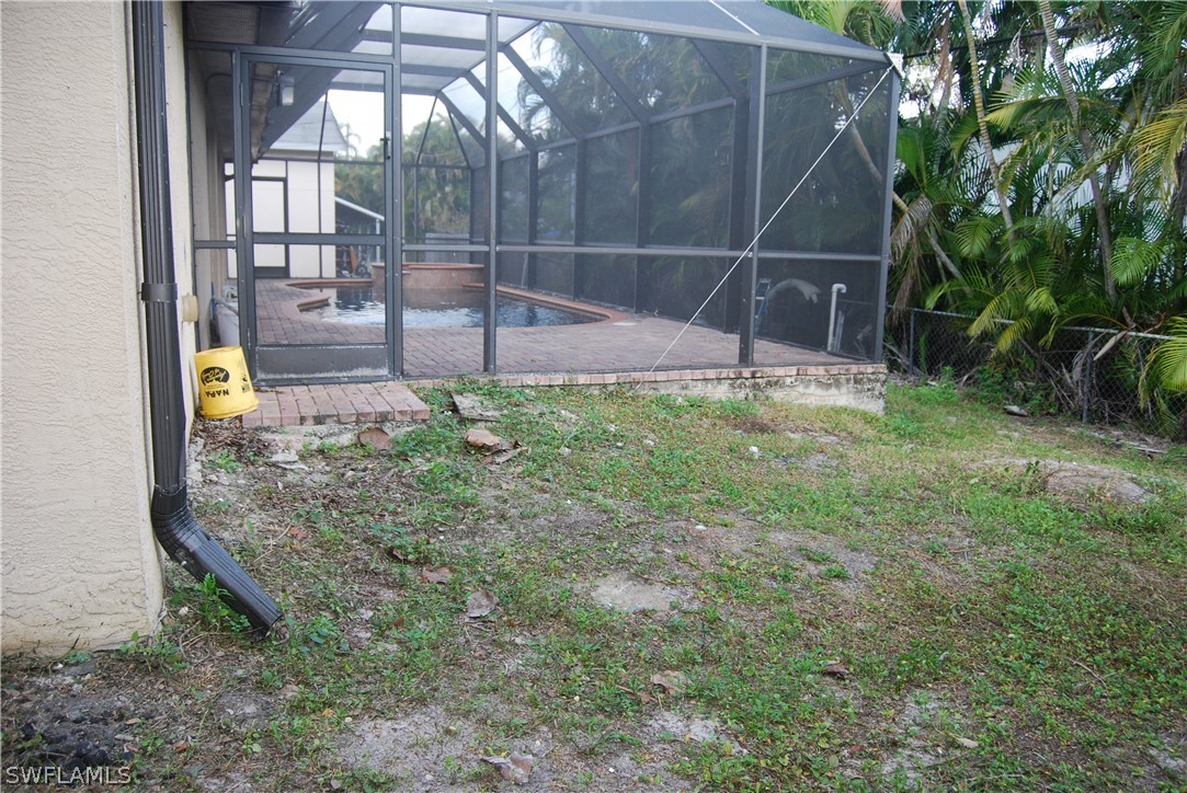 18561 Olive Road Fort Myers, FL 33967 - Photo 31 of 35 a backyard of a house with lots of green space